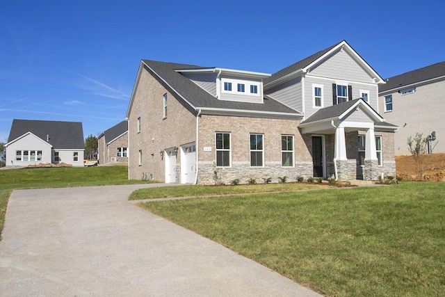 view of front of property with a garage and a front yard