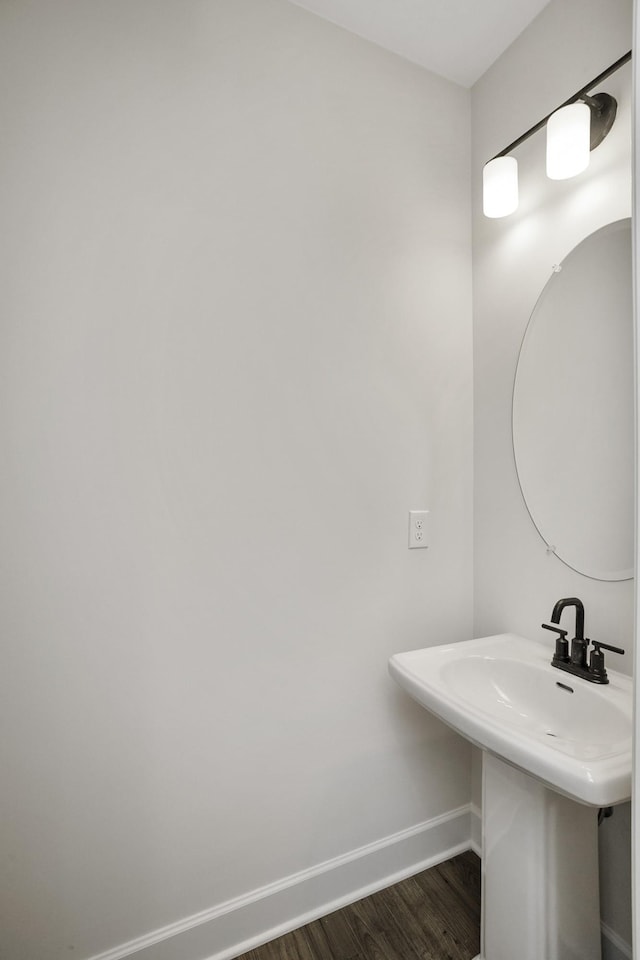 bathroom with sink and hardwood / wood-style floors