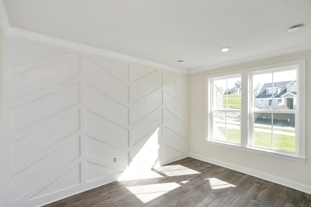 unfurnished room with dark wood-type flooring, ornamental molding, and a healthy amount of sunlight