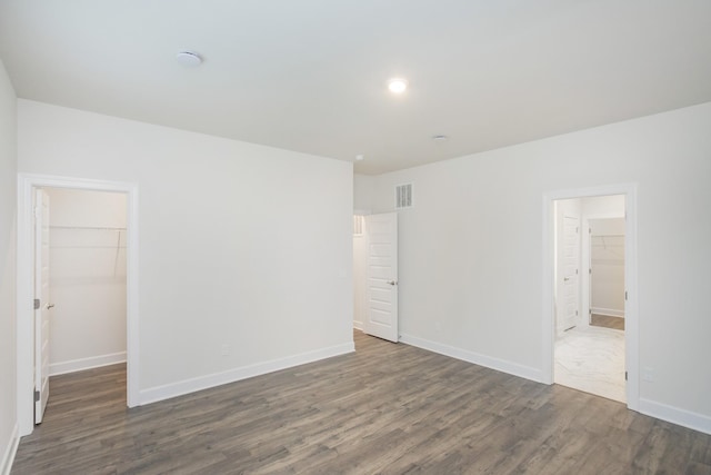 unfurnished room with dark hardwood / wood-style floors