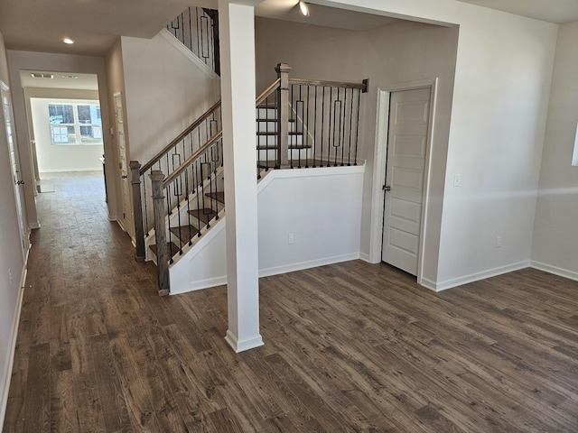 stairs featuring wood-type flooring