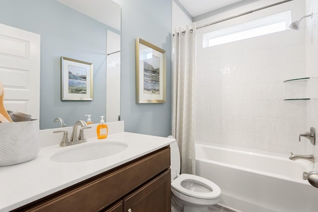 full bathroom with vanity, shower / tub combo with curtain, and toilet