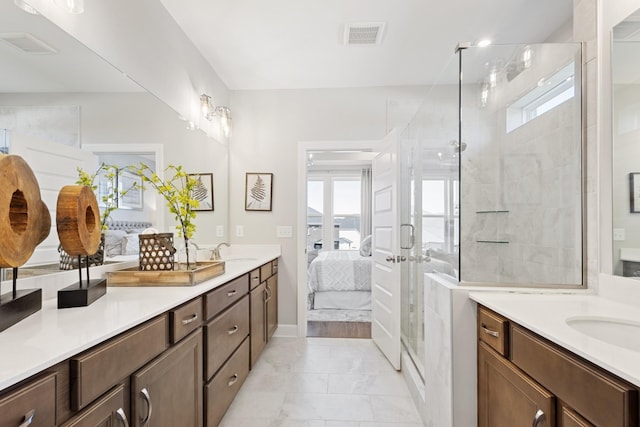 bathroom featuring vanity and a shower with shower door