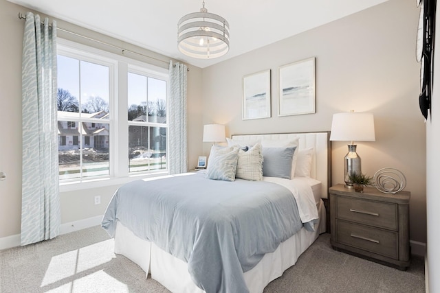 bedroom featuring light carpet