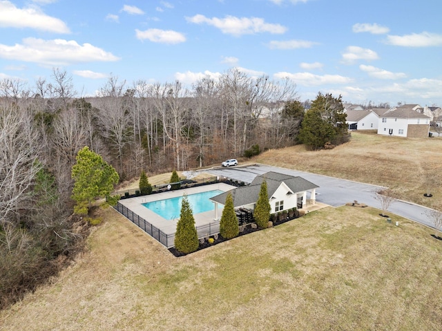 view of pool featuring a yard