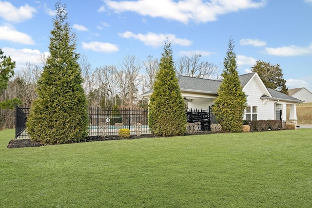 view of yard featuring a fenced in pool