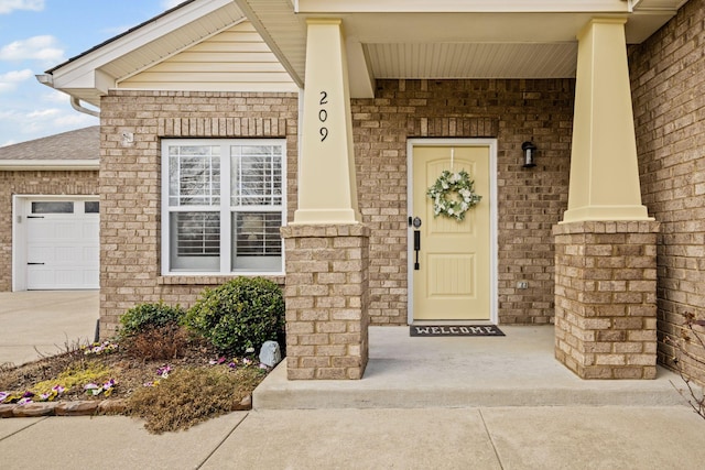 view of exterior entry featuring a garage