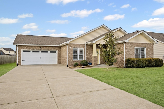 view of front of home featuring a garage and a front lawn