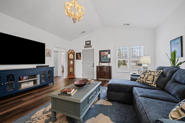 living room featuring lofted ceiling, dark hardwood / wood-style floors, and a chandelier