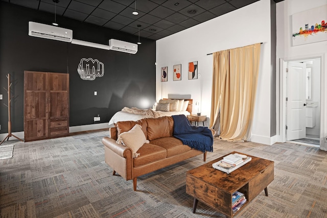 carpeted living room featuring a towering ceiling, a wall mounted air conditioner, and a drop ceiling