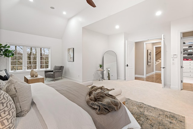 carpeted bedroom with lofted ceiling and ceiling fan