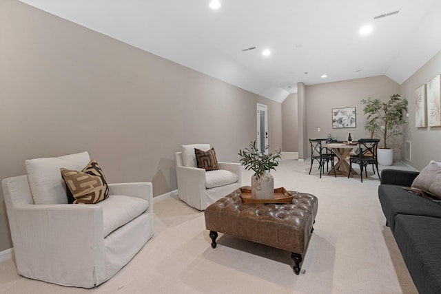 living room featuring light colored carpet and lofted ceiling