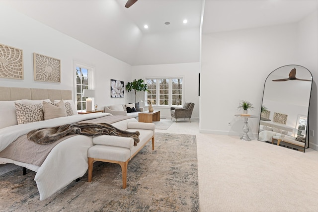 carpeted bedroom featuring ceiling fan and high vaulted ceiling