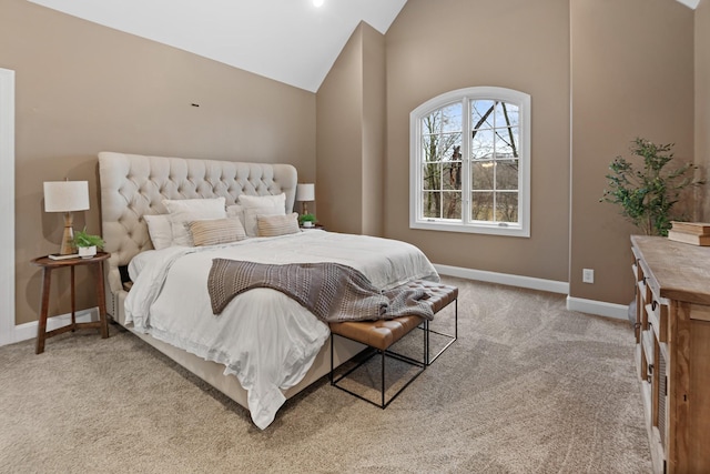 carpeted bedroom featuring high vaulted ceiling