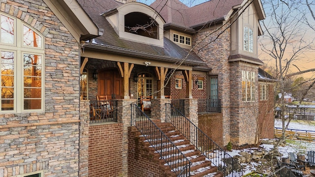 view of snow covered property entrance