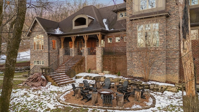 exterior space featuring an outdoor fire pit