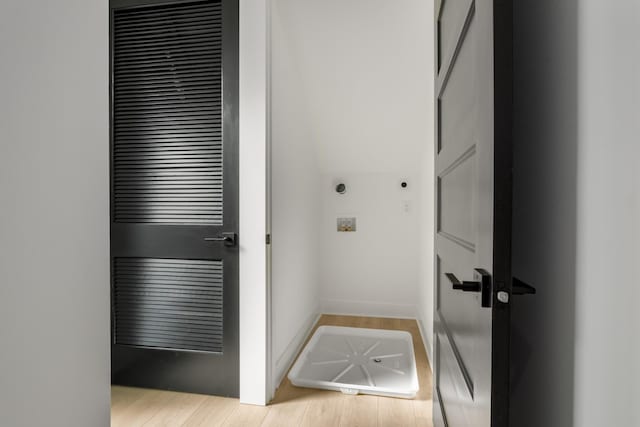 laundry room with light wood-type flooring