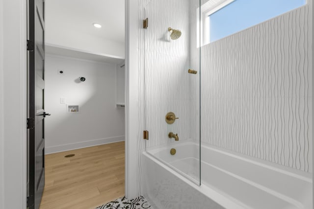 bathroom featuring shower / tub combination and hardwood / wood-style floors