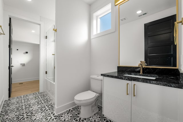 full bathroom with tile patterned flooring, vanity, bathing tub / shower combination, and toilet