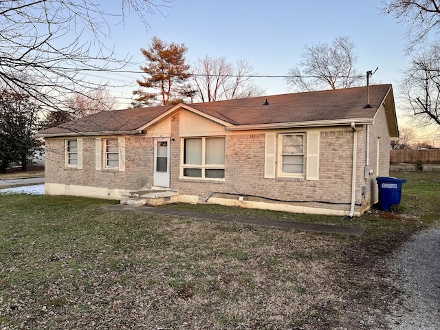 ranch-style house with a lawn