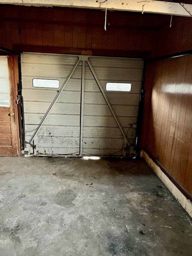 garage featuring wooden walls