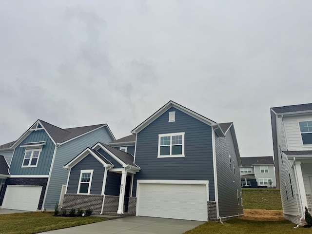 view of front facade with a garage and a front lawn