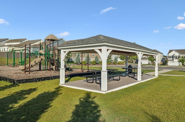 view of community with a gazebo, a playground, and a lawn