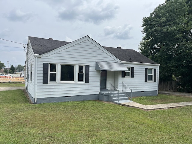 bungalow-style home with a front lawn