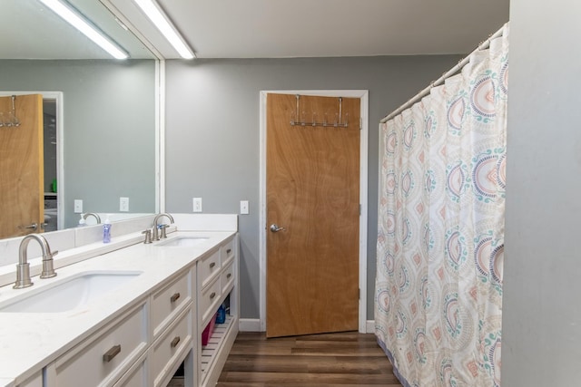 bathroom with vanity and hardwood / wood-style floors