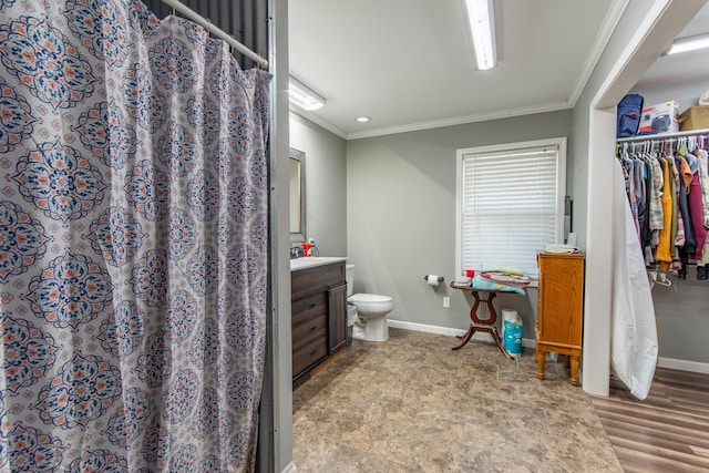 bathroom featuring crown molding, vanity, toilet, and a shower with curtain