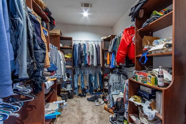 walk in closet featuring carpet