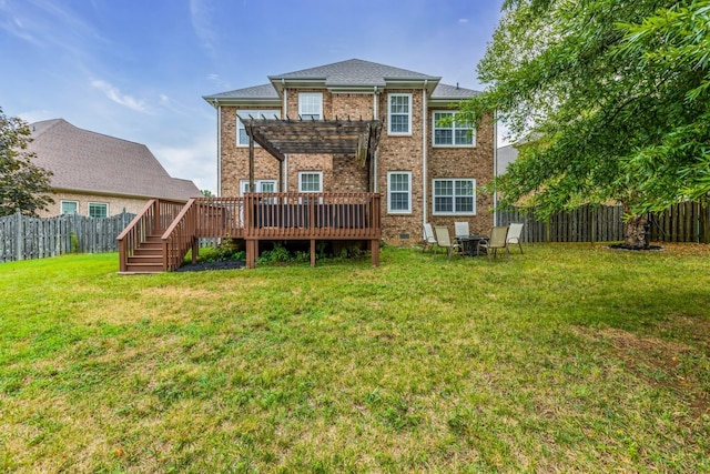 rear view of property featuring a wooden deck, a yard, and a pergola