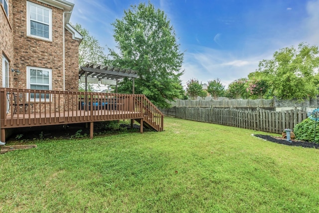 view of yard featuring a wooden deck and a pergola