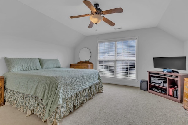 bedroom with carpet floors, vaulted ceiling, and ceiling fan