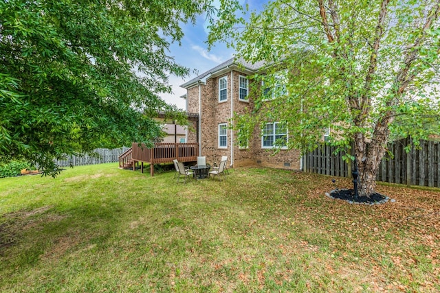 view of yard with a wooden deck