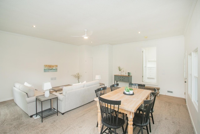 dining room featuring ornamental molding and ceiling fan