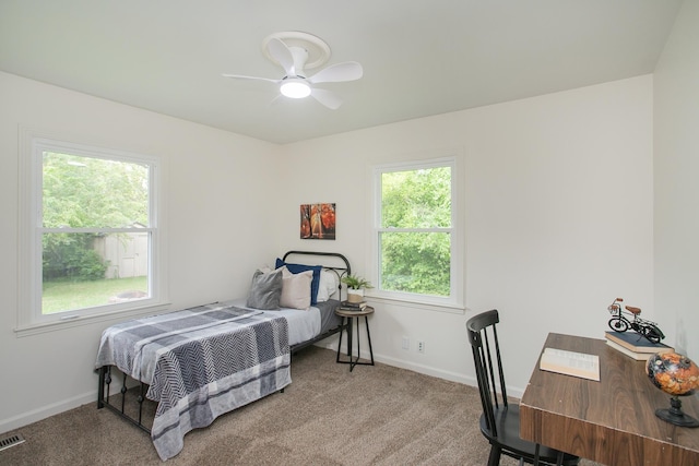 bedroom with ceiling fan and carpet floors