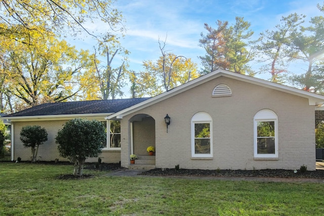 ranch-style house with a front yard