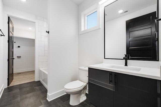 full bathroom with vanity, shower / tub combination, and toilet