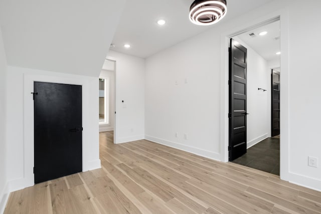 spare room featuring light hardwood / wood-style floors