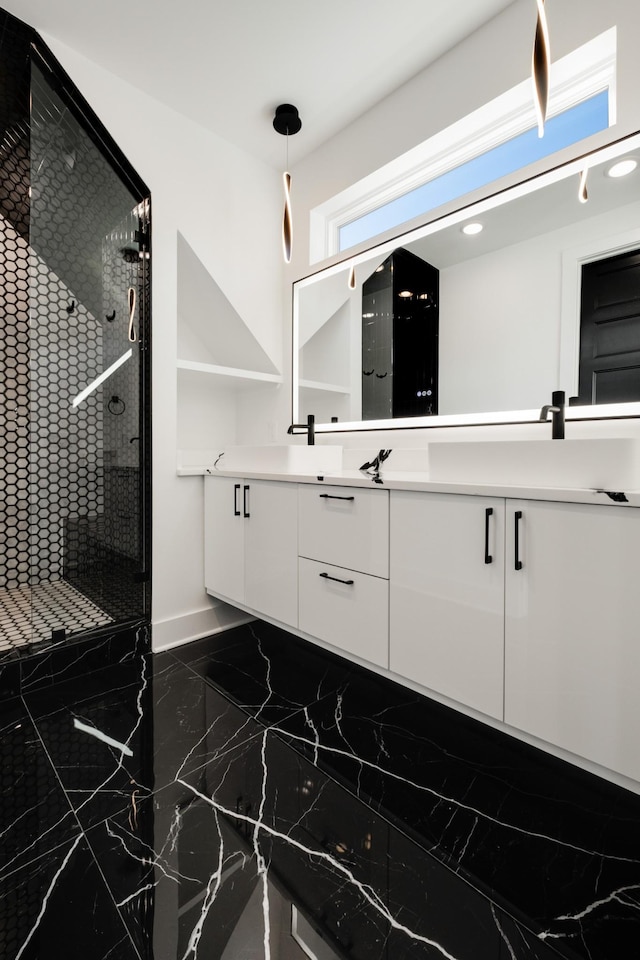 bathroom featuring vanity and a shower with shower door