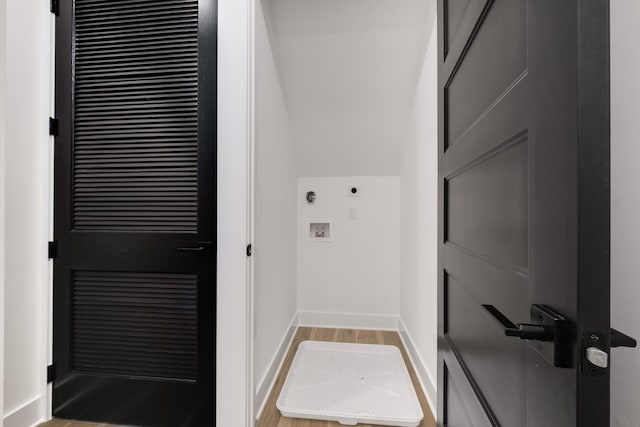 laundry room with washer hookup and light hardwood / wood-style floors