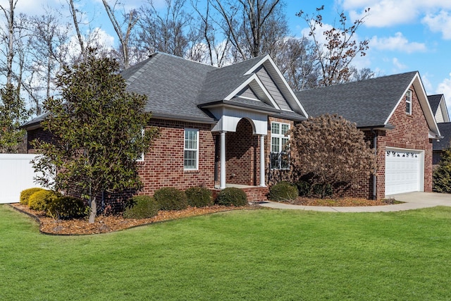 view of front of house featuring a garage and a front yard