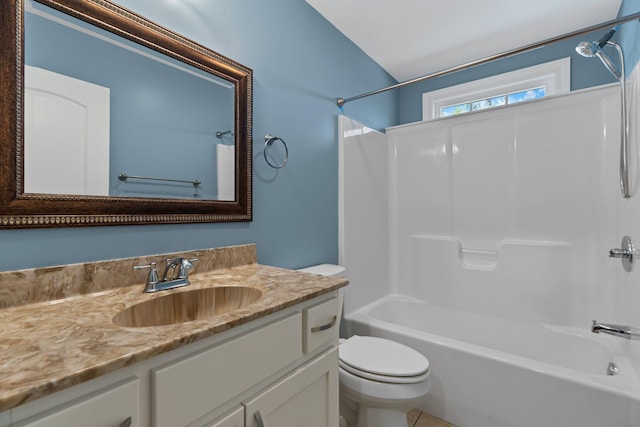 full bathroom with vanity, toilet, and  shower combination