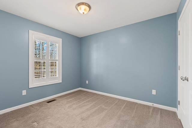 unfurnished room featuring carpet flooring