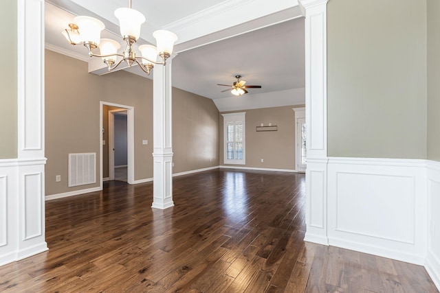 unfurnished room with dark wood-type flooring, ornate columns, vaulted ceiling, ornamental molding, and ceiling fan with notable chandelier