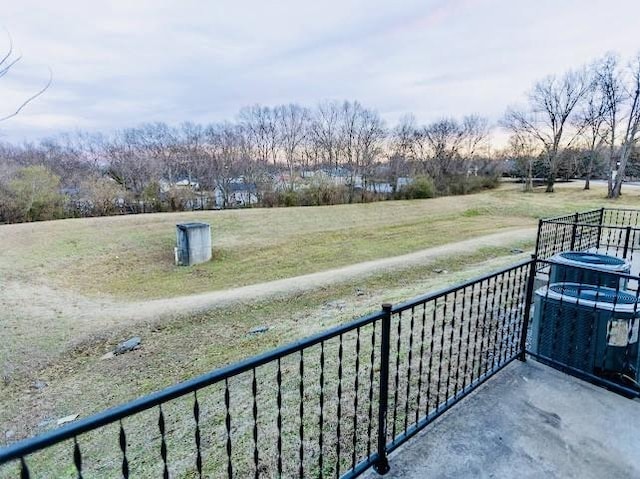 balcony with cooling unit and a rural view