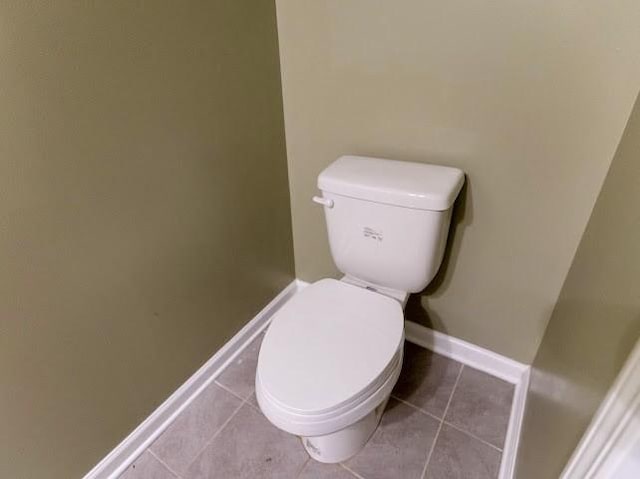 bathroom featuring tile patterned flooring and toilet