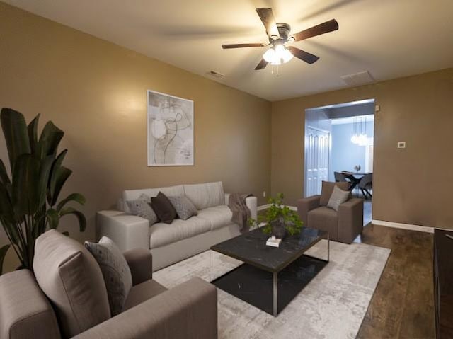 living room featuring hardwood / wood-style flooring and ceiling fan