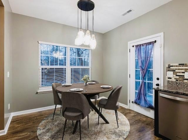 dining area featuring dark hardwood / wood-style flooring